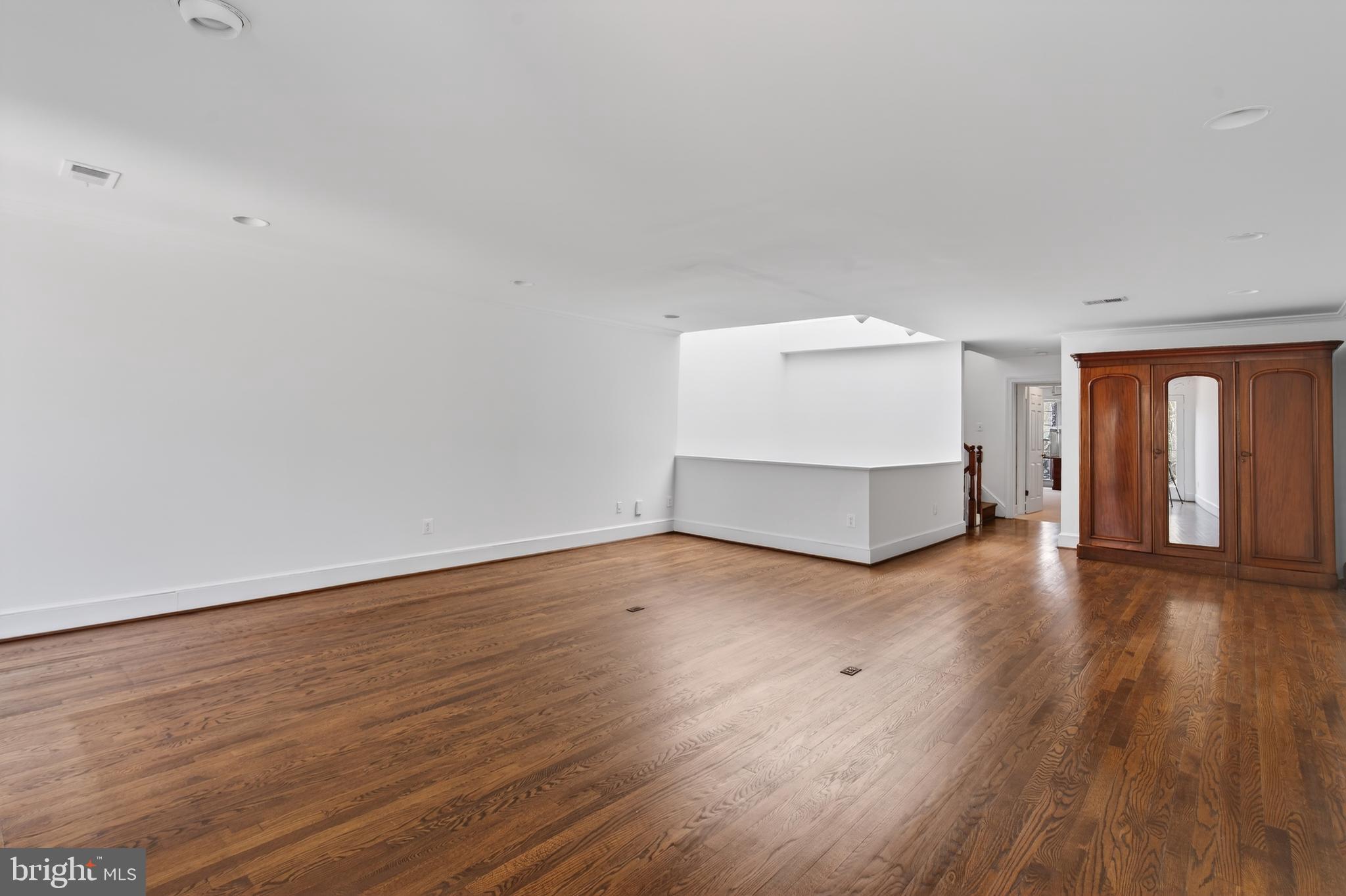 306 9th Street Southeast Washington, DC 20003 - Photo 29 of 50 a view of empty room with wooden floor and window
