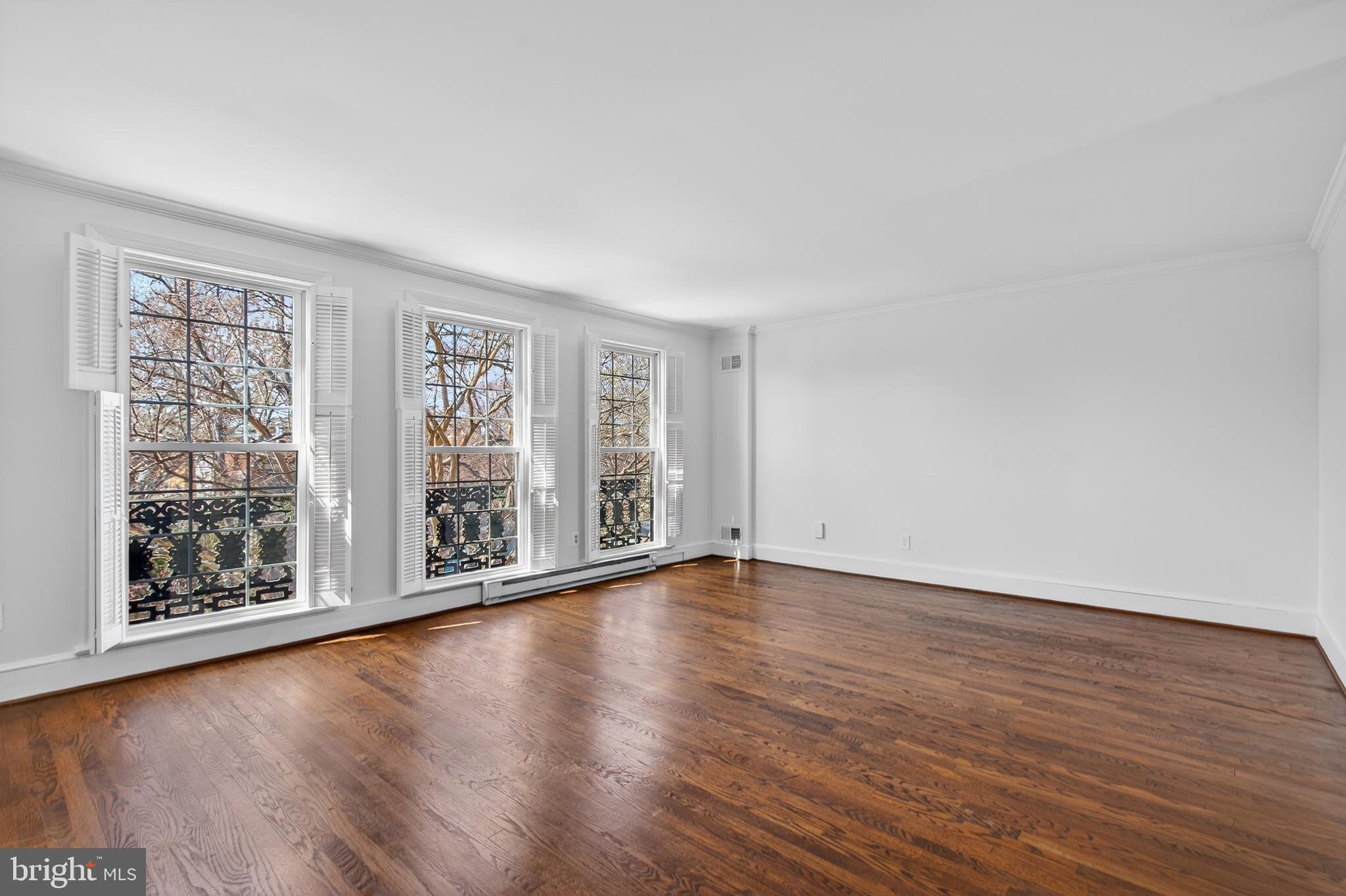 306 9th Street Southeast Washington, DC 20003 - Photo 37 of 50 a view of an empty room with glass door and wooden floor