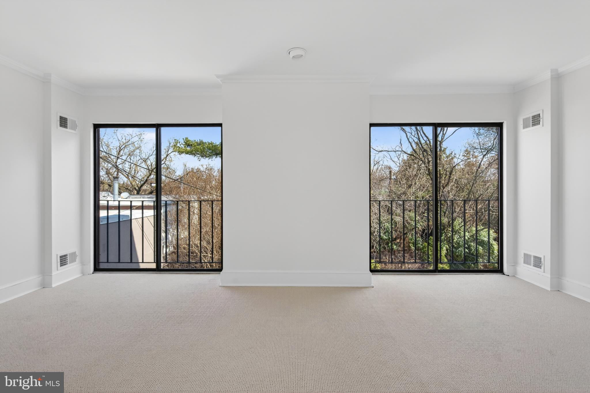 306 9th Street Southeast Washington, DC 20003 - Photo 42 of 50 an empty room with large windows