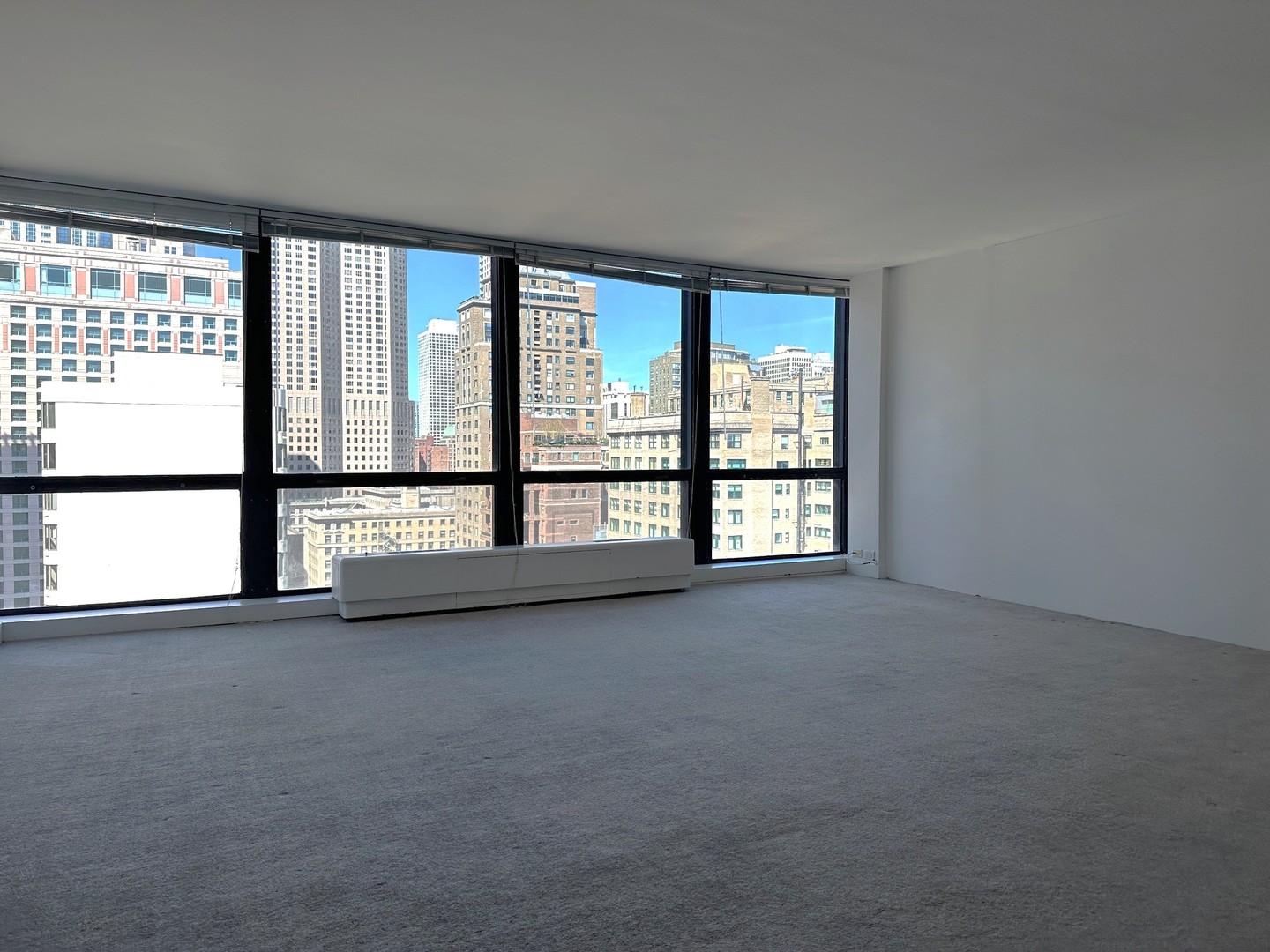 910 North Lake Shore Drive, Unit 2220 Chicago, IL 60611 - Photo 4 of 21 a view of an empty room with a large window
