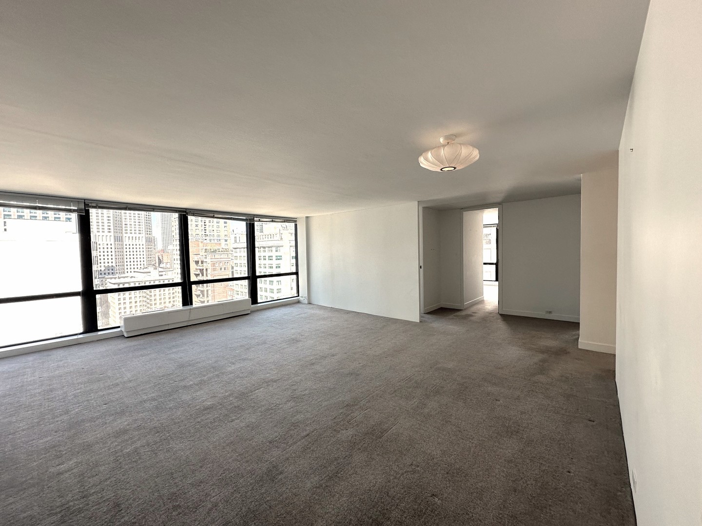 910 North Lake Shore Drive, Unit 2220 Chicago, IL 60611 - Photo 6 of 21 a view of an empty room with a window