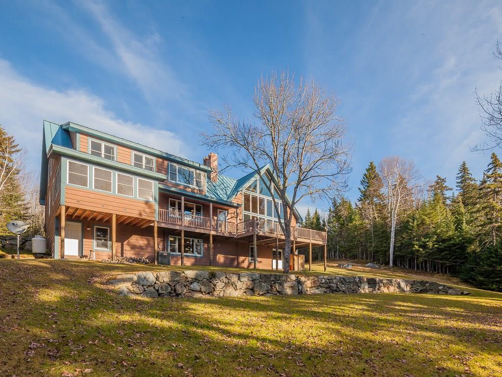 201 Pleasant Island Road Oquossoc, ME 04964 - Photo 2 of 31 view of house from water side,...