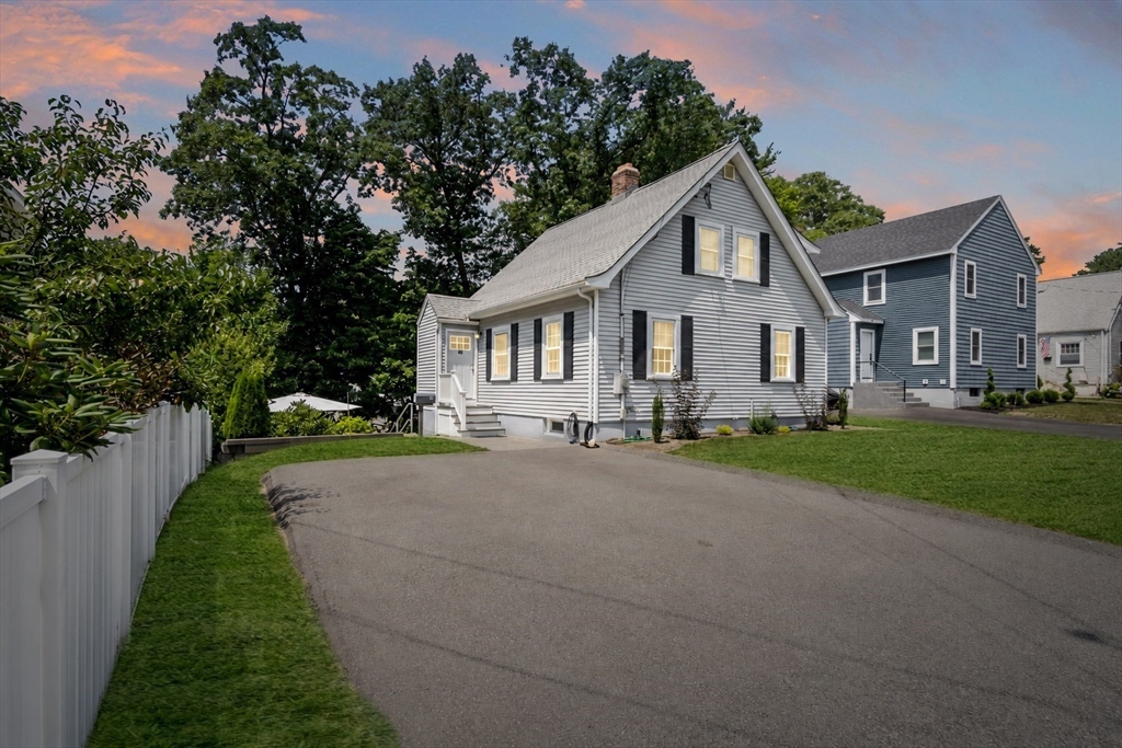 46 MacArthur Road Stoneham, MA 02180 - Photo 1 of 41 a front view of a house with a yard and garage
