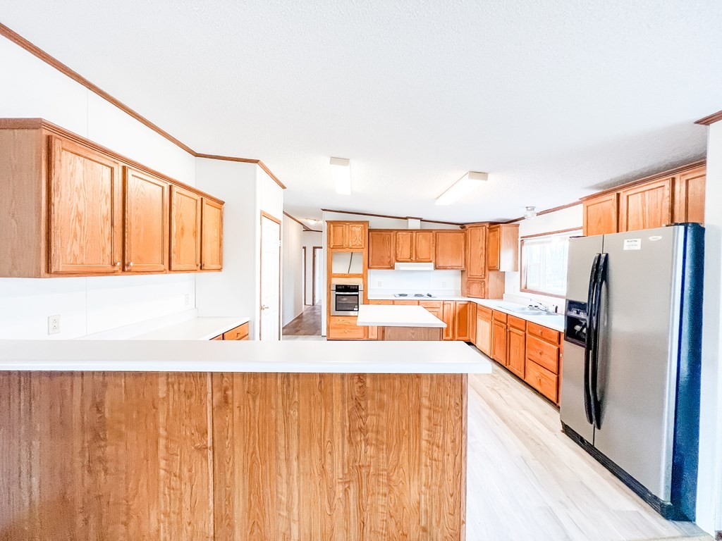 725 Hulon Ferrell Road Baxter, TN 38544 - Photo 8 of 31 a large white kitchen with a large window