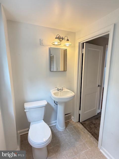 728 Oak Way Havertown, PA 19083 - Photo 13 of 26 a bathroom with a toilet sink and mirror