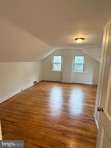 a bedroom with a bed and utility room