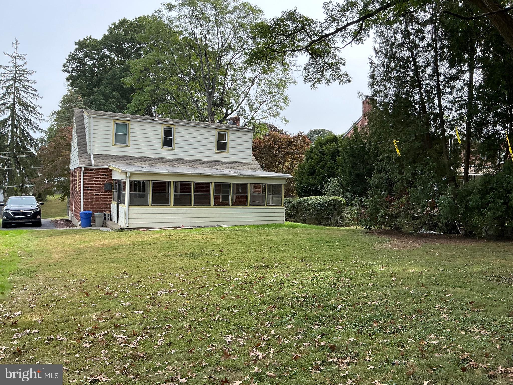 728 Oak Way Havertown, PA 19083 - Photo 3 of 26 a front view of a house with a garden