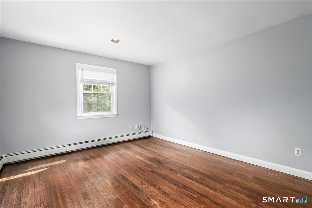 19 Botsford Hill Road Newtown, CT 06470 - Photo 23 of 40 an empty room with wooden floor and windows