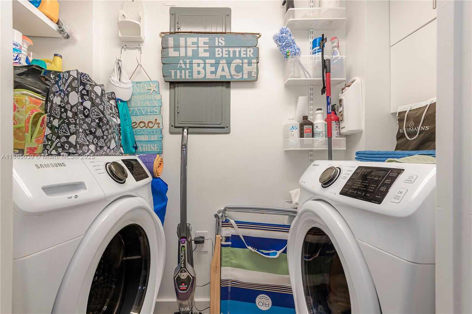 6917 Collins Avenue, Unit 511 Miami Beach, FL 33141 - Photo 12 of 24 a utility room with dryer and washer