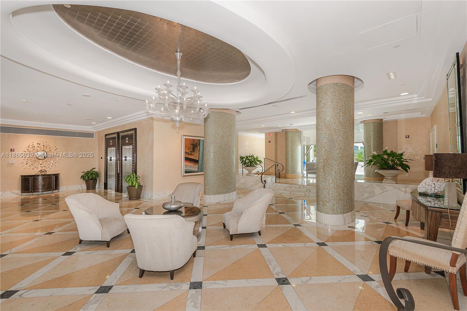 6917 Collins Avenue, Unit 511 Miami Beach, FL 33141 - Photo 2 of 24 a living room with furniture and chandelier