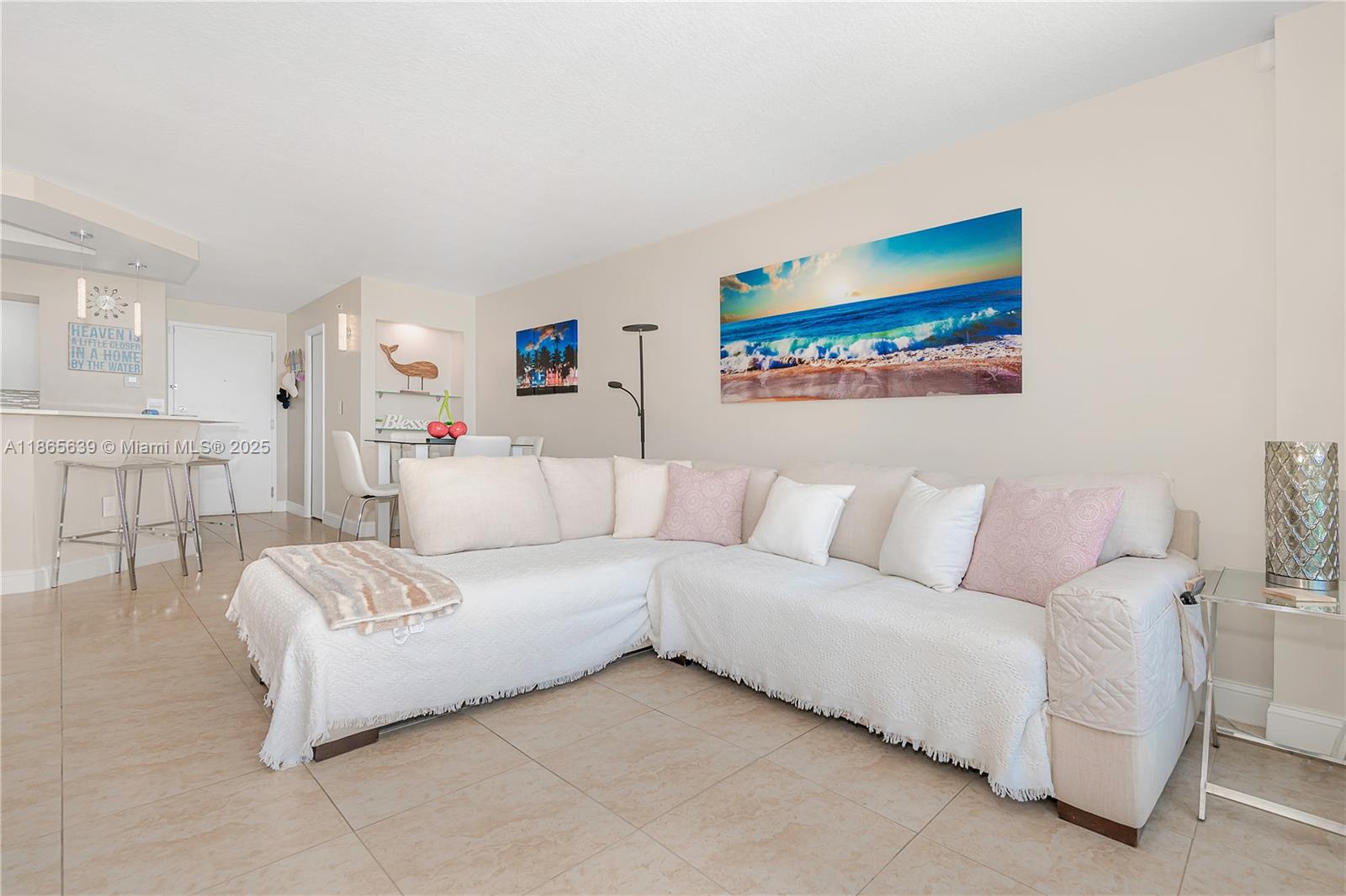 6917 Collins Avenue, Unit 511 Miami Beach, FL 33141 - Photo 3 of 24 a living room with furniture and a couch