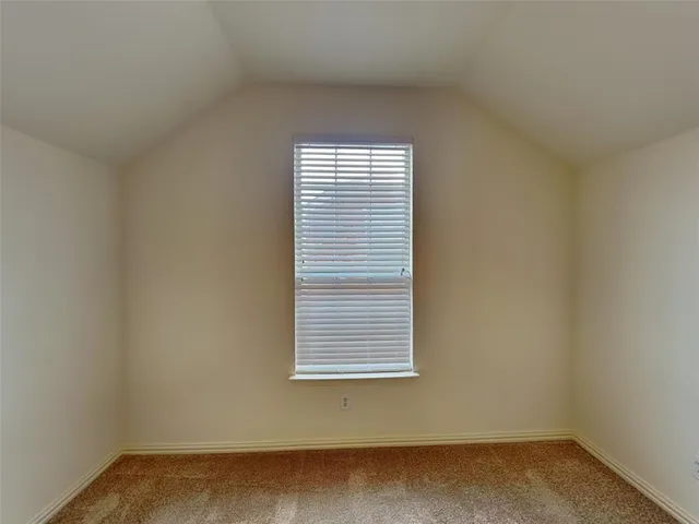 an empty room with closet area