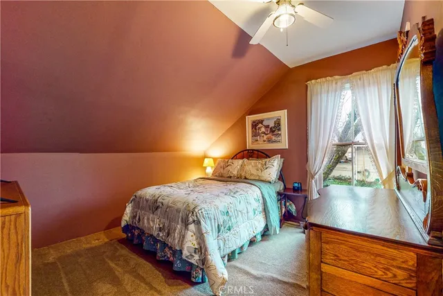 a kitchen with stainless steel appliances granite countertop a refrigerator a stove and a sink with cabinets