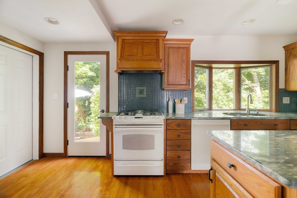 52 St Mary's Road Milton, MA 02186 - Photo 13 of 32 a kitchen with a stove a sink and a refrigerator