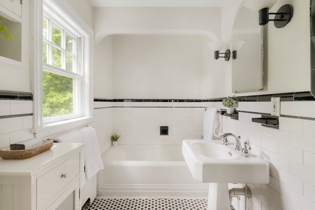 52 St Mary's Road Milton, MA 02186 - Photo 21 of 32 a bathroom with a sink and a bathtub