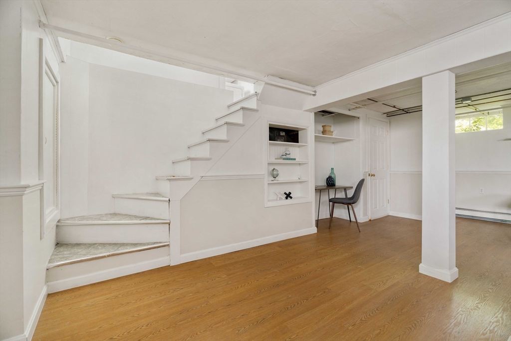 52 St Mary's Road Milton, MA 02186 - Photo 24 of 32 a view of an empty room with stairs and ventilation