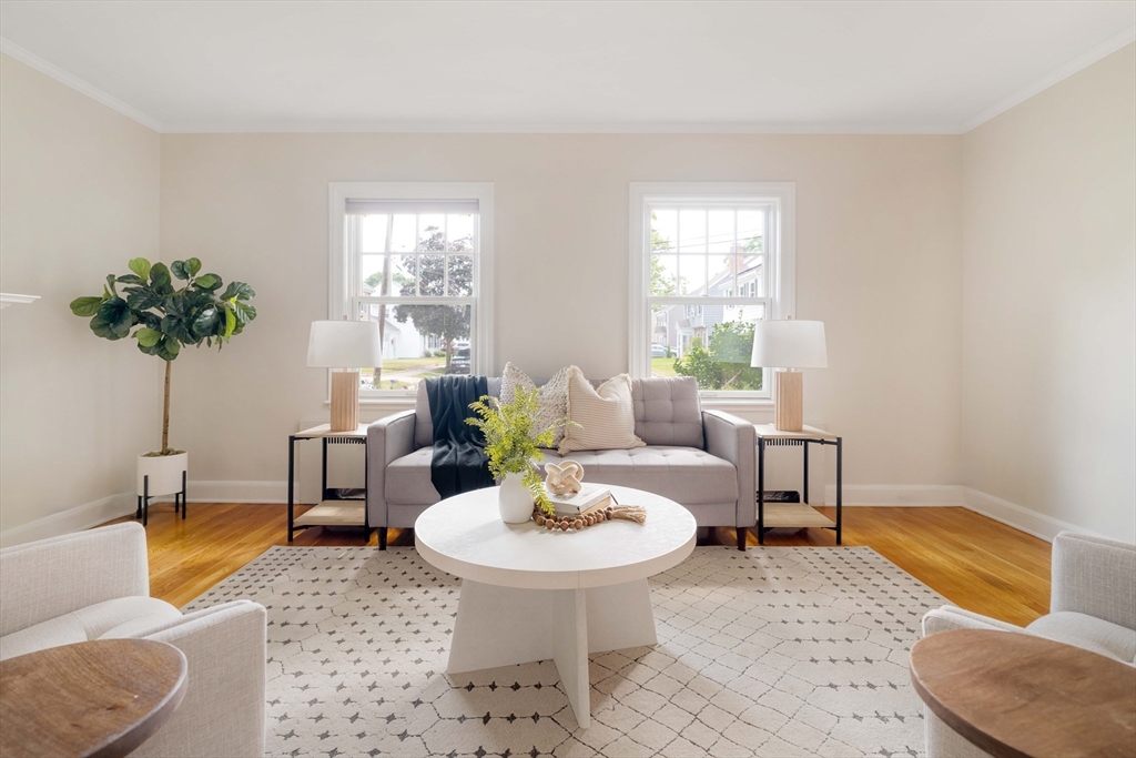 52 St Mary's Road Milton, MA 02186 - Photo 4 of 32 a living room with furniture and a potted plant