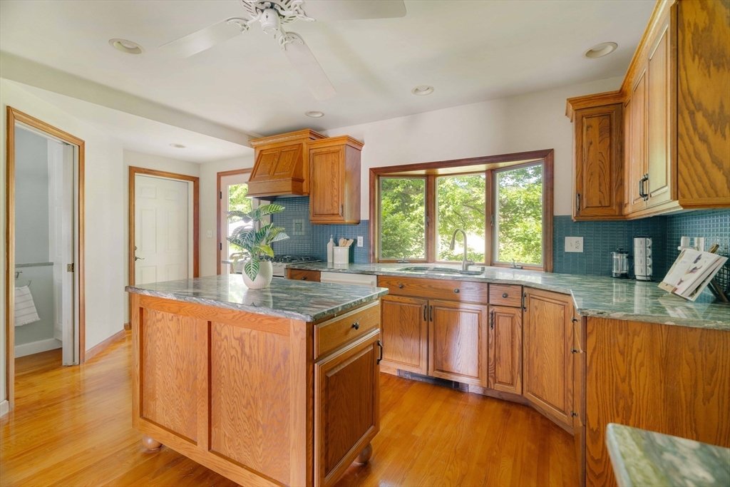 52 St Mary's Road Milton, MA 02186 - Photo 10 of 32 a kitchen with stainless steel appliances granite countertop a sink stove and refrigerator