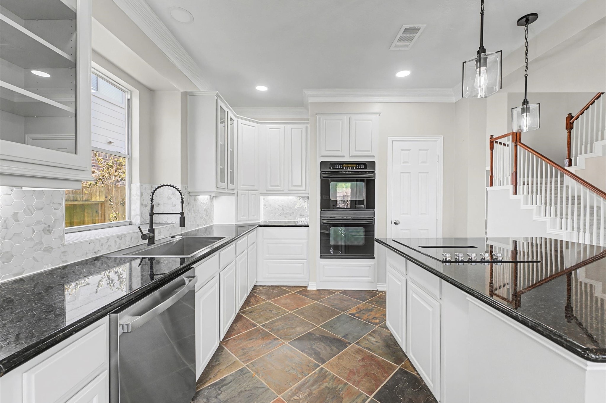 15442 Bay Tree Landing Cypress, TX 77429 - Photo 13 of 46 The freshly painted cabinets offer a smooth, clean and modern look. Double electric oven, new stainless-steel farmhouse sink and pull-down faucet.