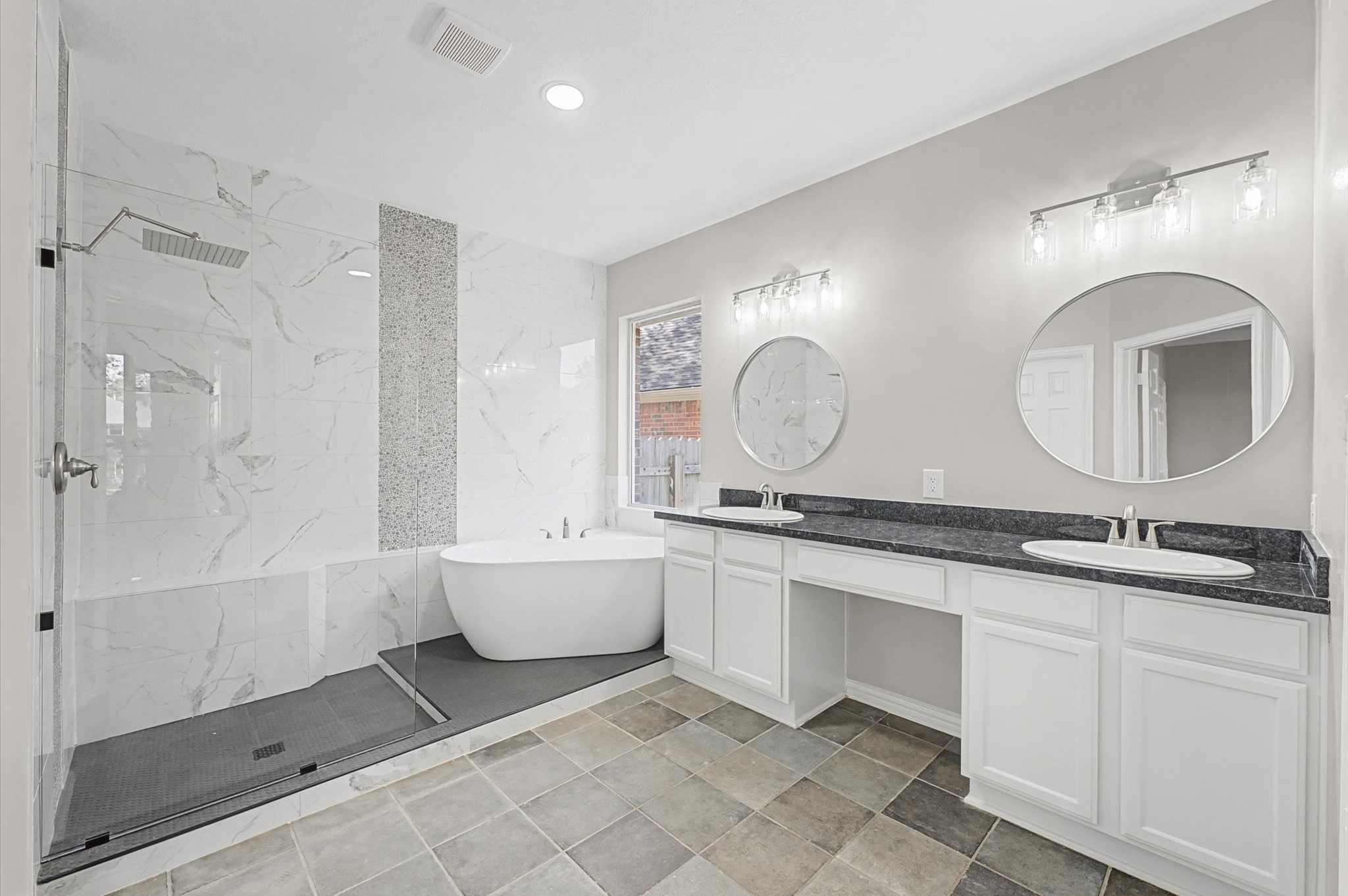 15442 Bay Tree Landing Cypress, TX 77429 - Photo 24 of 46 The Primary bath is absolutely beautiful! Custom-built frameless shower, cut to size with convenience and ease of use in mind. Brand new white gloss bathtub, mirrors, lighting, faucets and more!