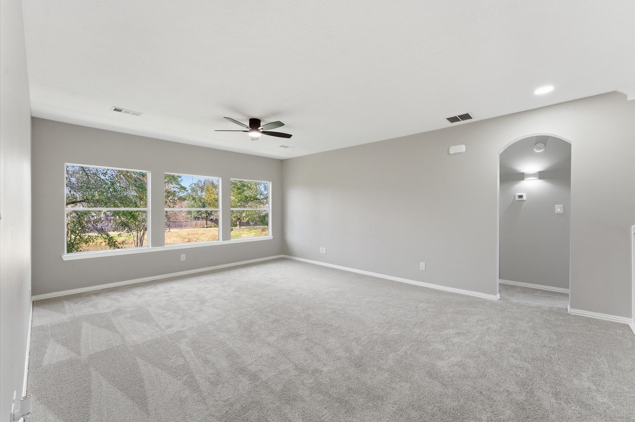 15442 Bay Tree Landing Cypress, TX 77429 - Photo 28 of 46 Game room perspective from the other side. Great views of the backyard & nature trail. The kids can drop water balloons on their siblings in the backyard!