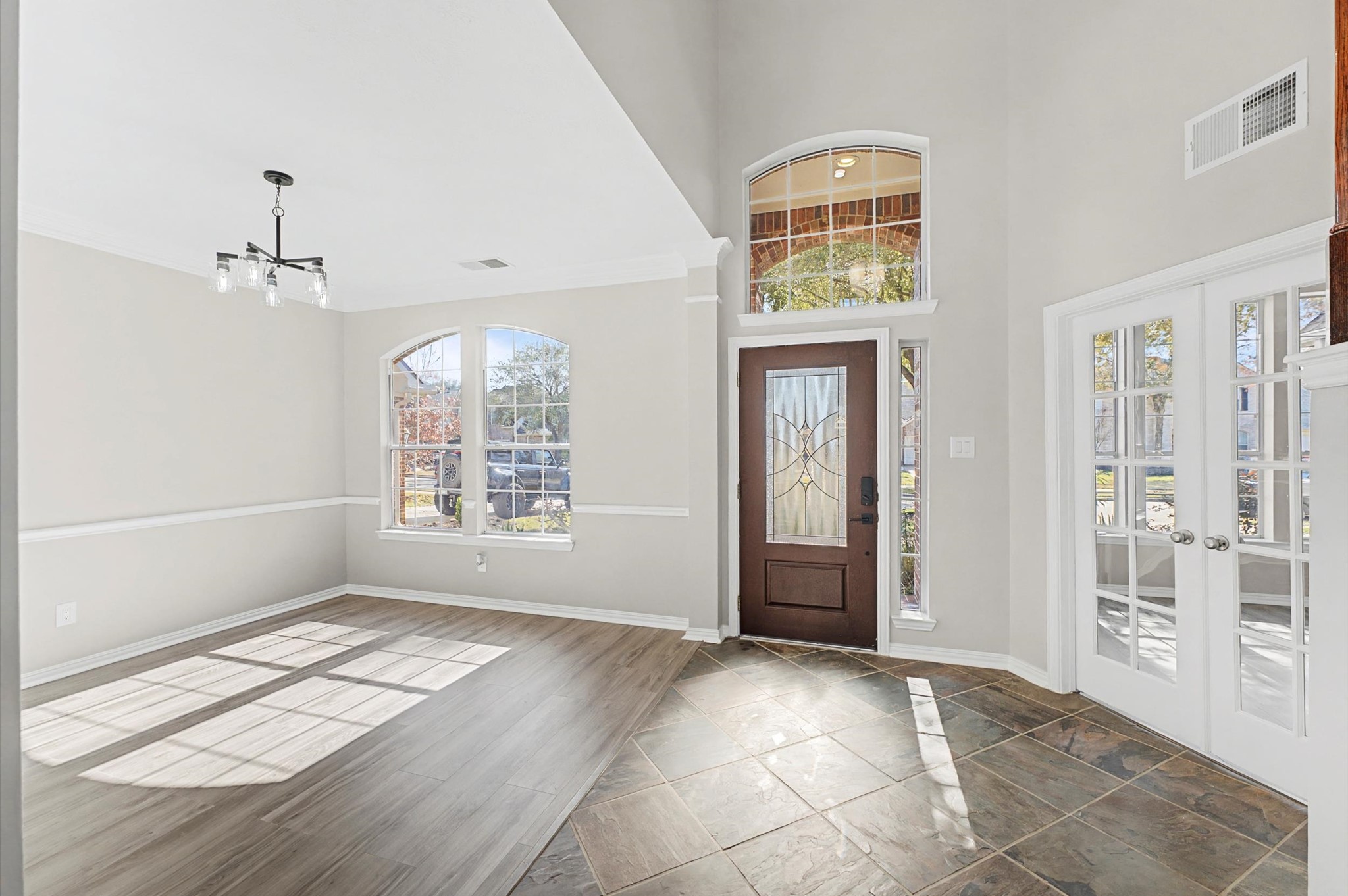 15442 Bay Tree Landing Cypress, TX 77429 - Photo 6 of 46 The formal dining room is to the left & the study is to the right. Brand new front door offering a decorative glass insert with a leaded glass design providing both aesthetic appeal and natural light while maintaining privacy.