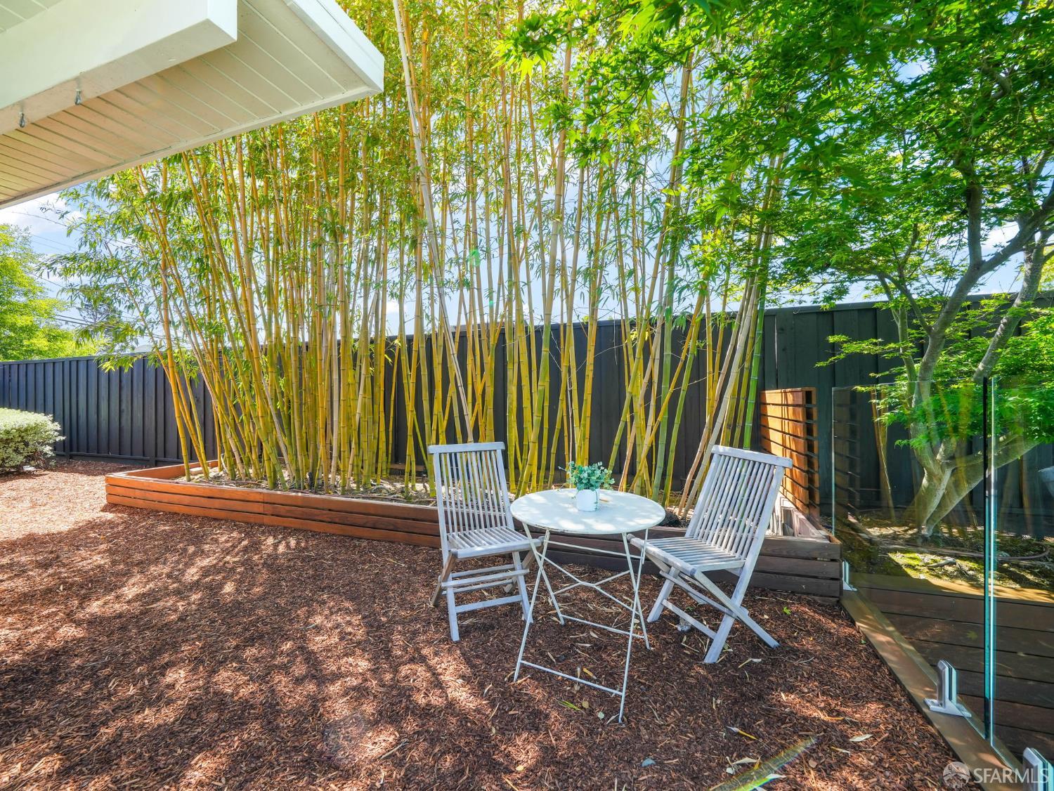 5664 Greenridge Road Castro Valley, CA 94552 - Photo 36 of 59 a view of a chairs and table in the backyard with a wooden fence