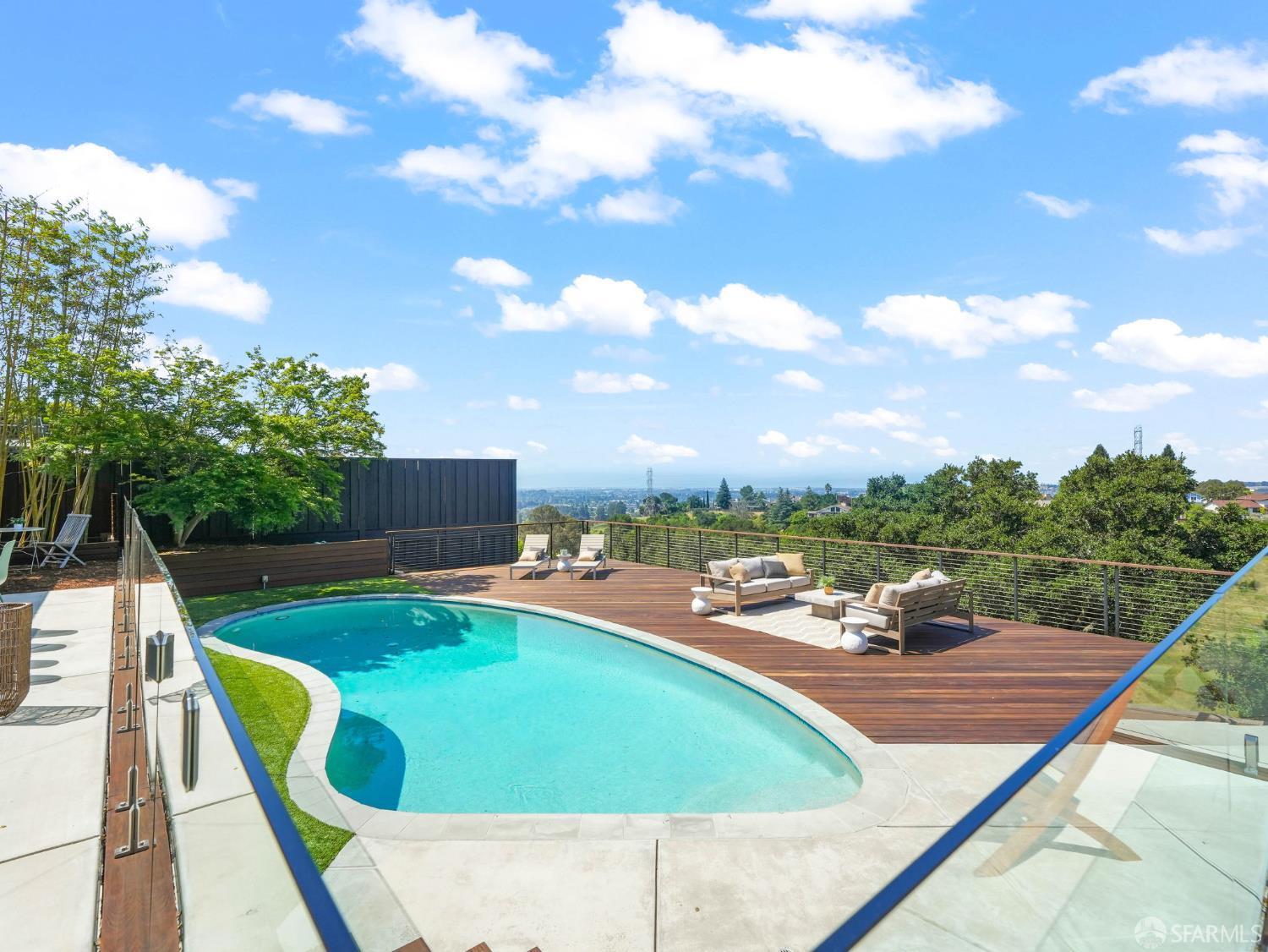 5664 Greenridge Road Castro Valley, CA 94552 - Photo 39 of 59 a view of a swimming pool with a lounge chair