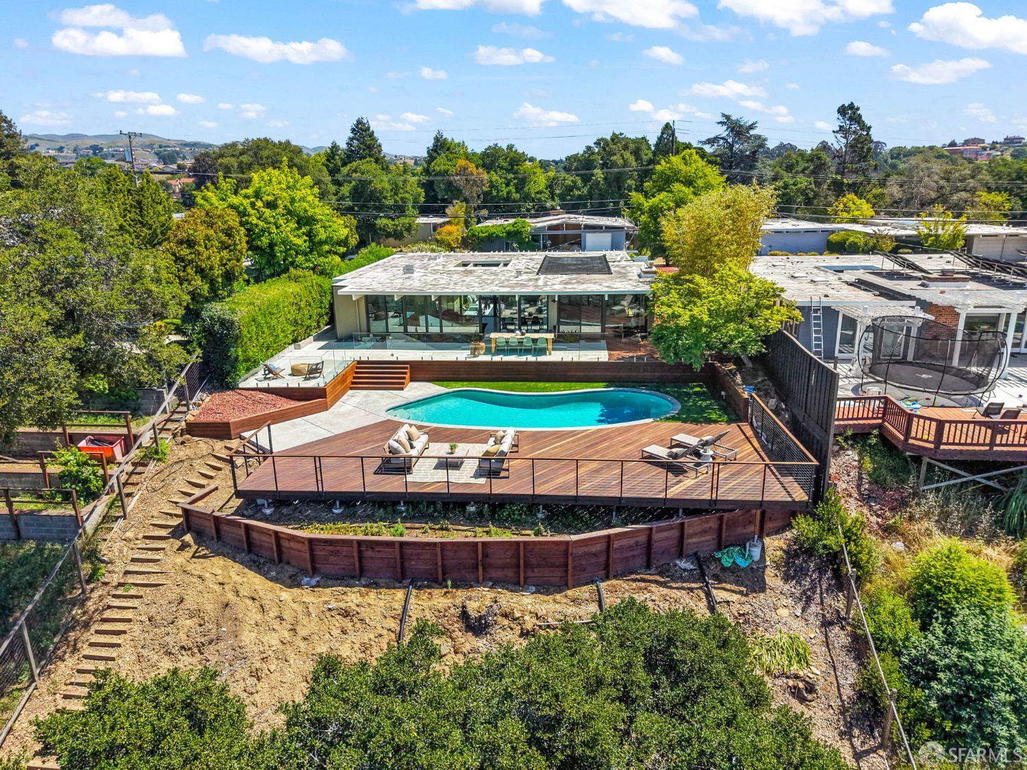 5664 Greenridge Road Castro Valley, CA 94552 - Photo 56 of 59 an aerial view of a house with a garden and lake view