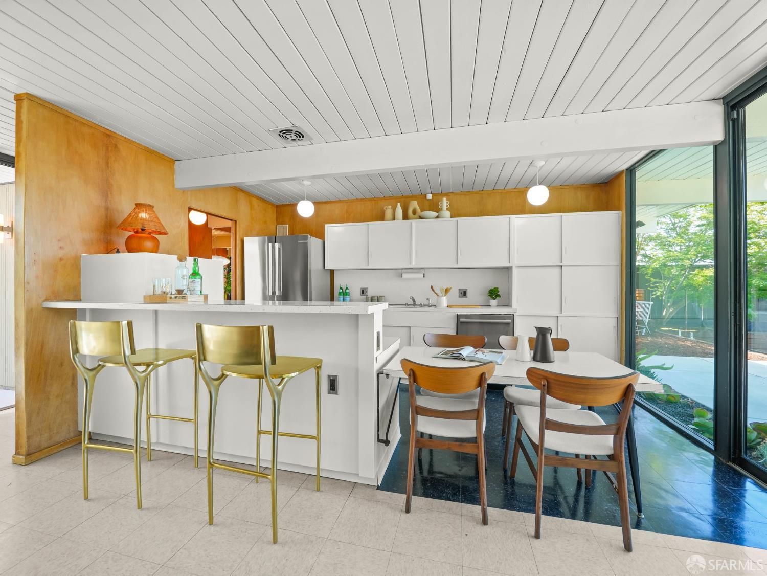 5664 Greenridge Road Castro Valley, CA 94552 - Photo 7 of 59 a dining table chairs and a kitchen view