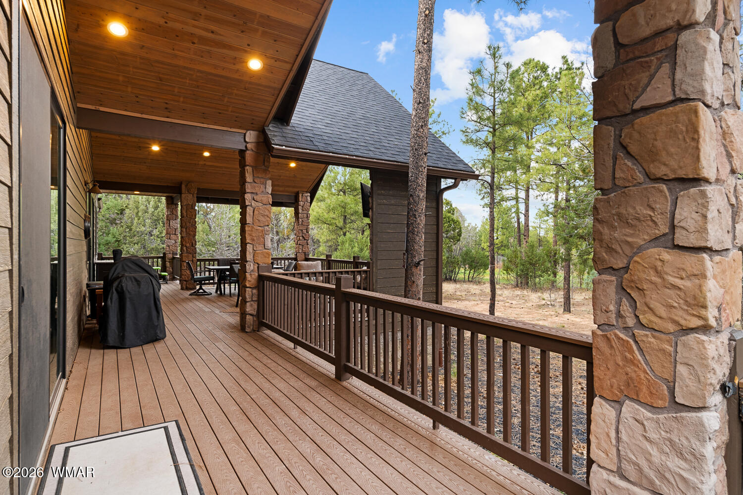 3360 West Blazingstar Road Show Low, AZ 85901 - Photo 23 of 71 a view of a balcony with floor to ceiling windows with wooden floor