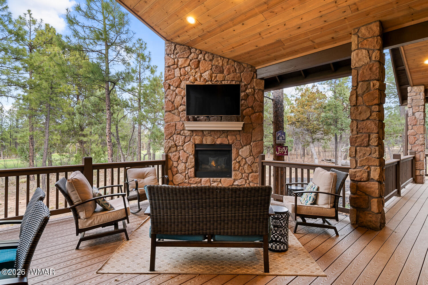 3360 West Blazingstar Road Show Low, AZ 85901 - Photo 25 of 71 a view of a balcony with furniture and a fireplace