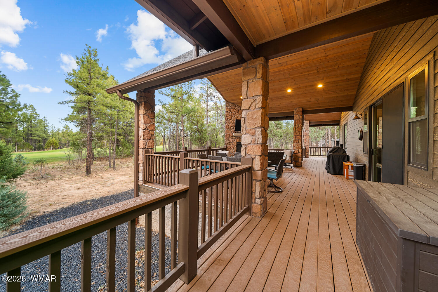 3360 West Blazingstar Road Show Low, AZ 85901 - Photo 27 of 71 a view of a balcony with couches and wooden floor