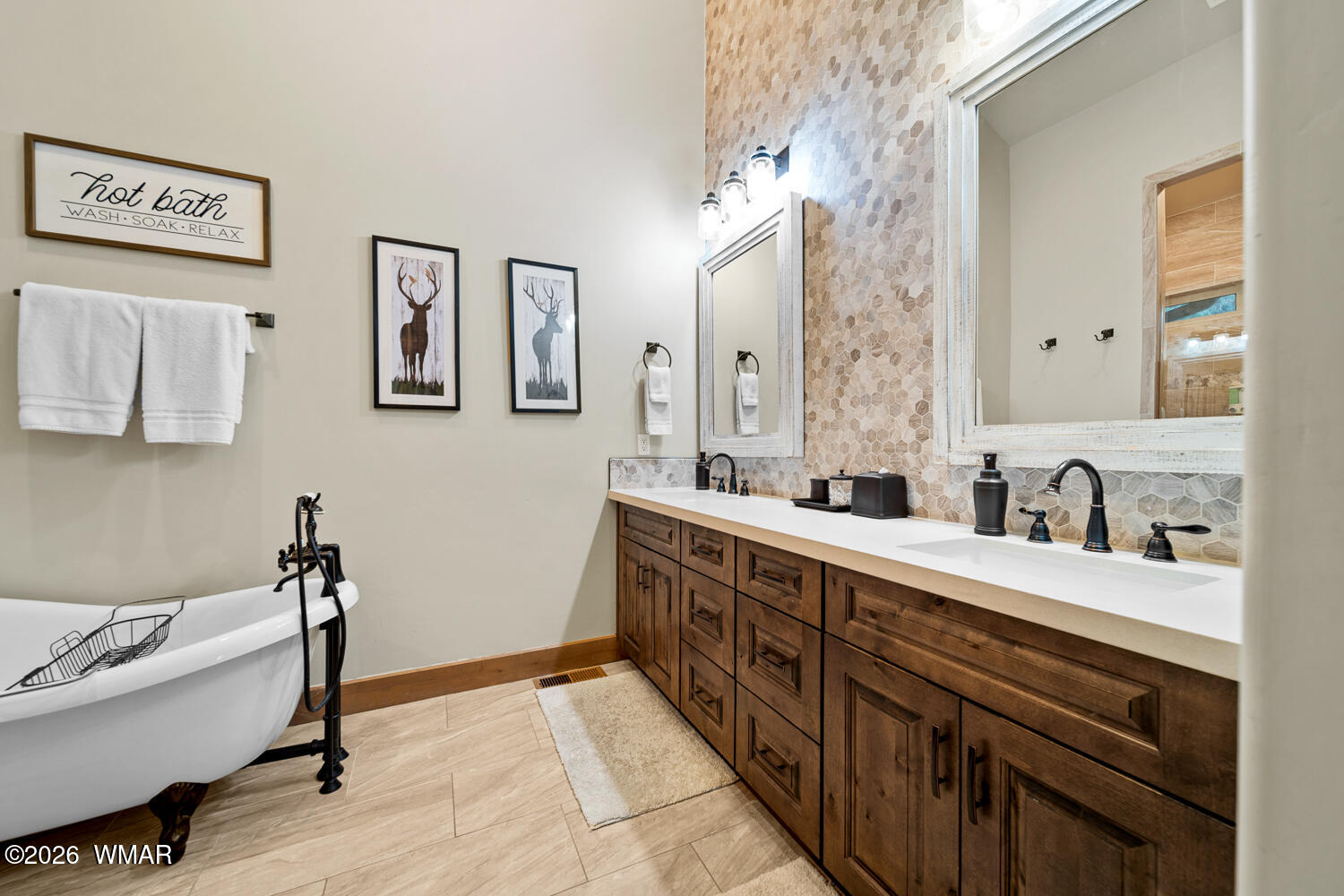 3360 West Blazingstar Road Show Low, AZ 85901 - Photo 45 of 71 a spacious bathroom with a double vanity sink a mirror and a