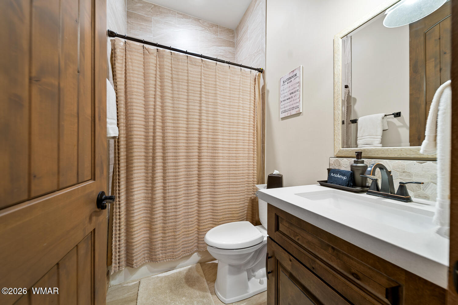 3360 West Blazingstar Road Show Low, AZ 85901 - Photo 59 of 71 a bathroom with a sink a toilet and shower