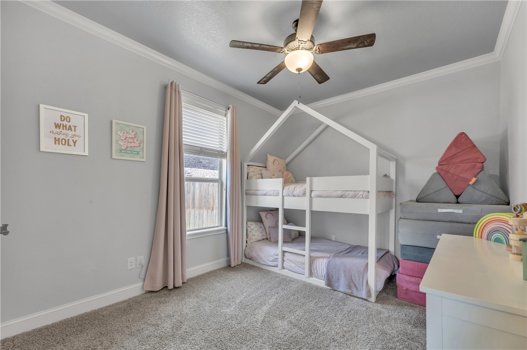 8312 Raintree Drive College Station, TX 77845 - Photo 19 of 30 Room featuring light gray walls, white crown molding, and gray carpet