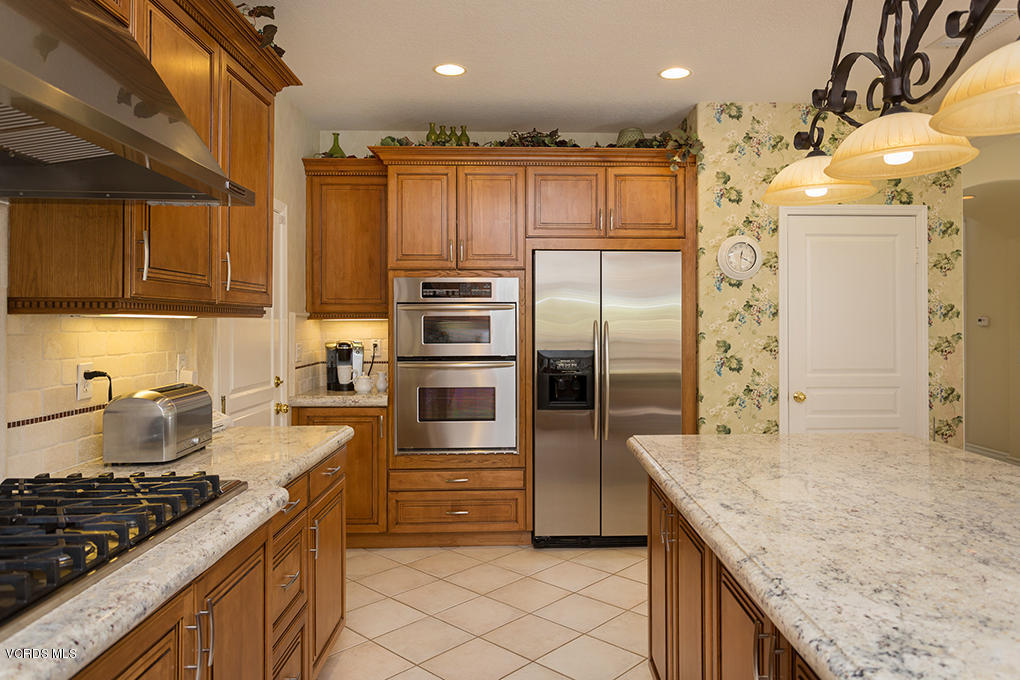 210 Knoll Ridge Road Simi Valley, CA 93065 - Photo 14 of 46 a kitchen with granite countertop a sink stove and refrigerator