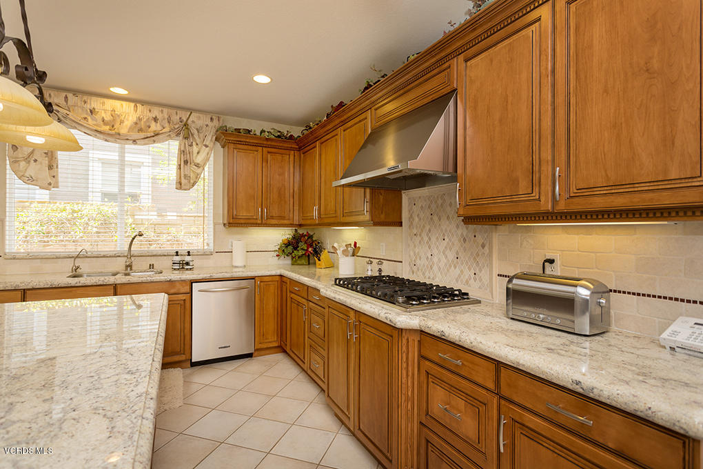 210 Knoll Ridge Road Simi Valley, CA 93065 - Photo 16 of 46 a kitchen with stainless steel appliances granite countertop a sink stove and cabinets