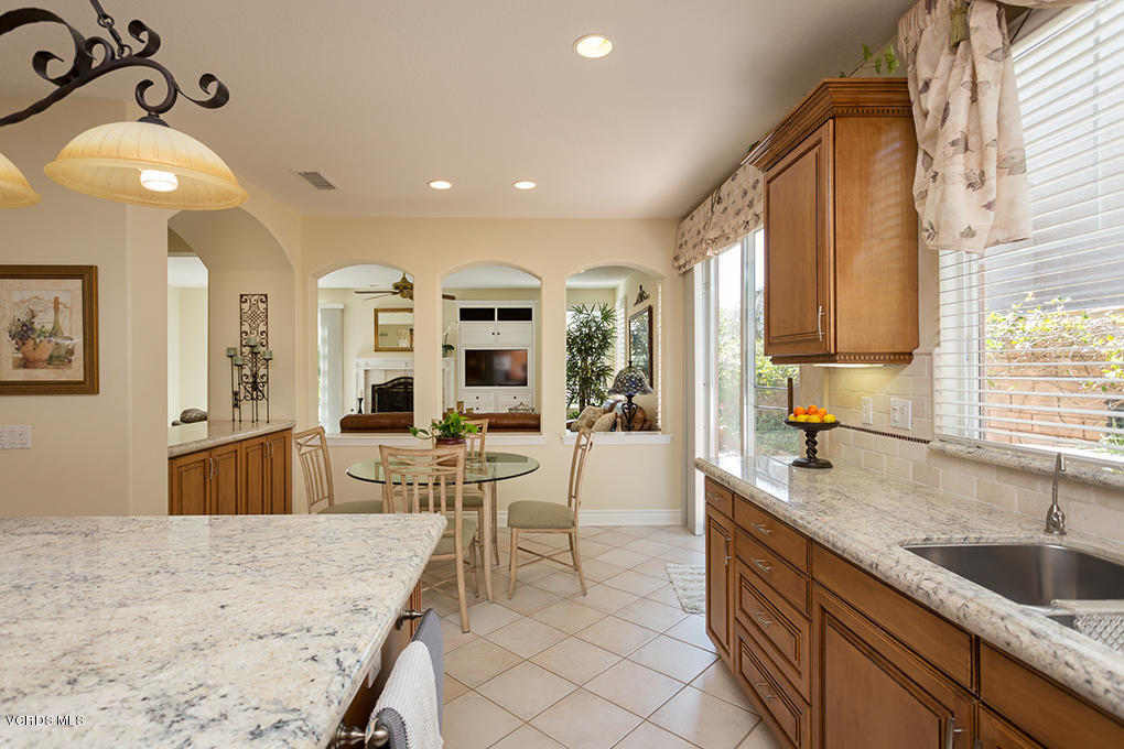 210 Knoll Ridge Road Simi Valley, CA 93065 - Photo 17 of 46 a large kitchen with kitchen island a large counter top space a sink stainless steel appliances and cabinets