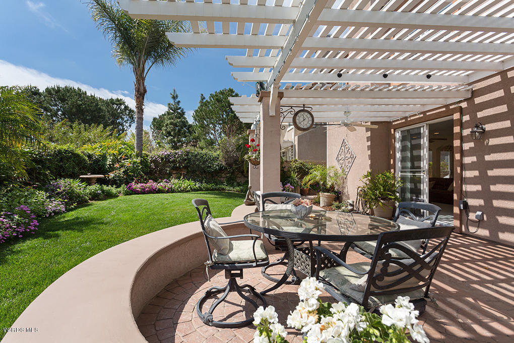 210 Knoll Ridge Road Simi Valley, CA 93065 - Photo 21 of 46 a view of a patio with table and chairs and potted plants