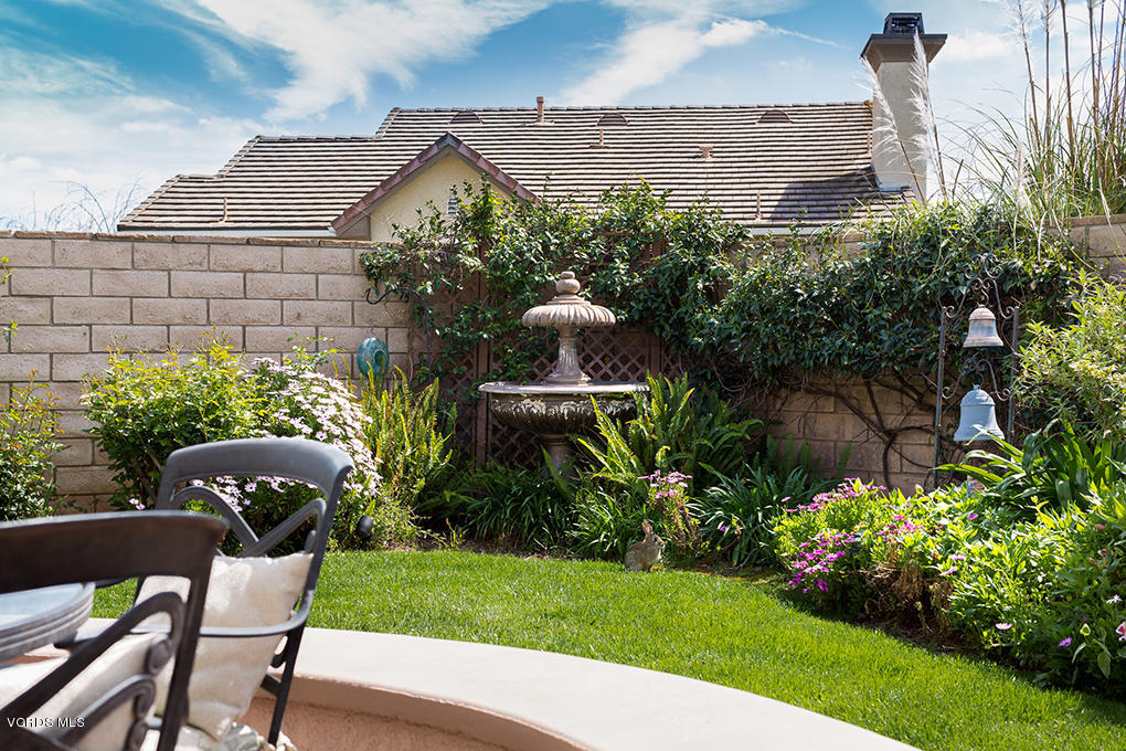 210 Knoll Ridge Road Simi Valley, CA 93065 - Photo 23 of 46 a front view of a house with a yard and plants