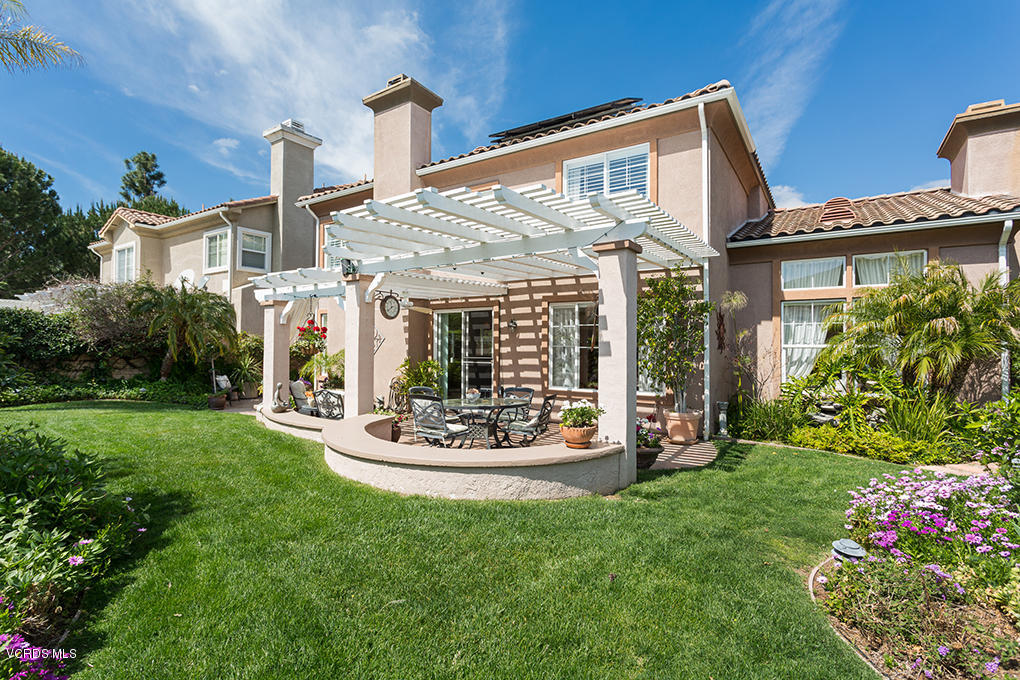 210 Knoll Ridge Road Simi Valley, CA 93065 - Photo 24 of 46 a front view of a house with a garden and plants