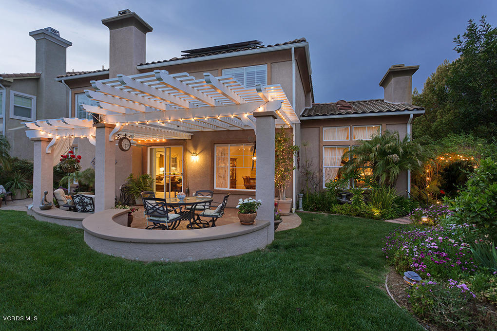 210 Knoll Ridge Road Simi Valley, CA 93065 - Photo 25 of 46 a view of a house with patio and a garden