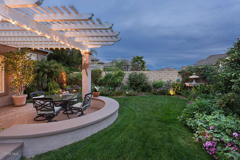 210 Knoll Ridge Road Simi Valley, CA 93065 - Photo 32 of 46 a view of a chairs and table in backyard of the house