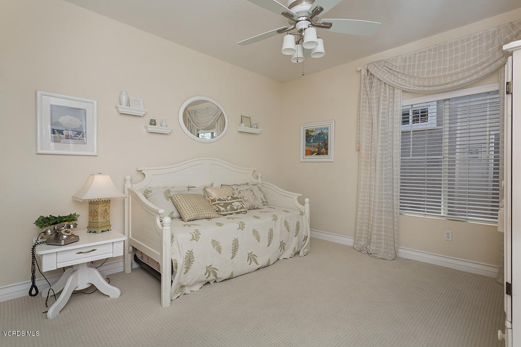 210 Knoll Ridge Road Simi Valley, CA 93065 - Photo 37 of 46 a bedroom with a bed and a window