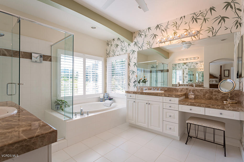 210 Knoll Ridge Road Simi Valley, CA 93065 - Photo 40 of 46 a spacious bathroom with a granite countertop sink mirror and bathtub