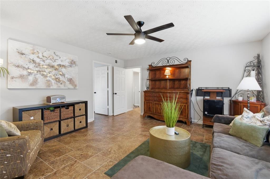 1856 Whitley Road Bethlehem, GA 30620 - Photo 17 of 28 a living room with furniture and a flat screen tv