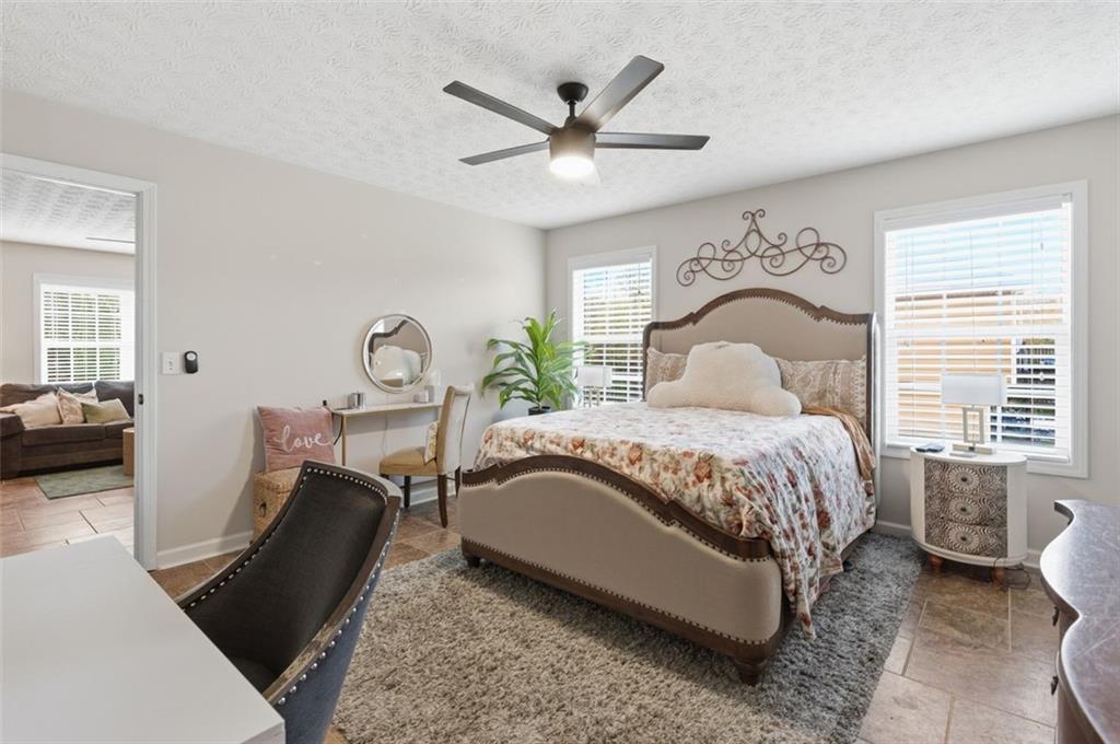 1856 Whitley Road Bethlehem, GA 30620 - Photo 19 of 28 a bedroom with a bed and a large window