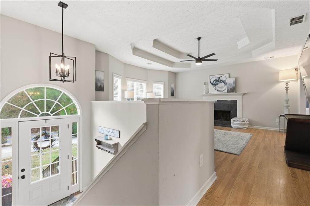 1856 Whitley Road Bethlehem, GA 30620 - Photo 6 of 28 a view of a livingroom with furniture entryway wooden floor and a chandelier