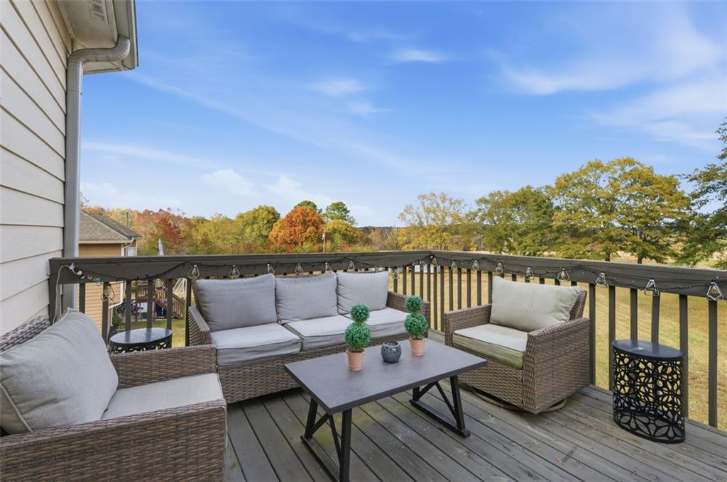 1856 Whitley Road Bethlehem, GA 30620 - Photo 9 of 28 a roof deck with couches and wooden floor